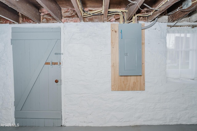 unfinished basement featuring electric panel