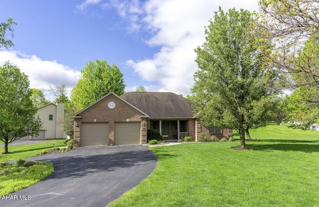 216 Red Fox Dr, Duncansville, PA 16635 - view of front of property featuring brick siding, an attached garage, asphalt driveway, and a front yard
