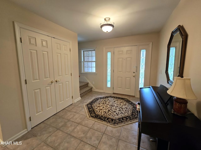 216 Red Fox Dr, Duncansville, PA 16635 - entryway with light tile patterned flooring, stairway, and baseboards
