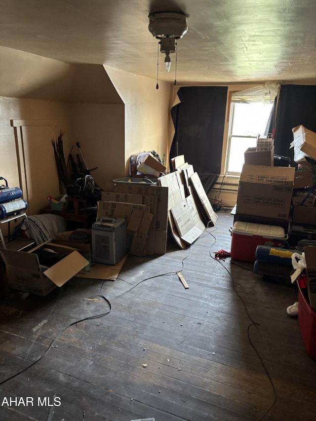 additional living space featuring dark hardwood / wood-style flooring and vaulted ceiling