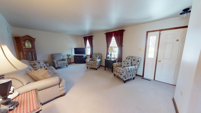 carpeted living room featuring visible vents