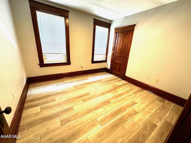 unfurnished room featuring light hardwood / wood-style floors