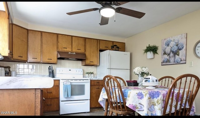 kitchen featuring decorative backsplash, white appliances, and ceiling fan