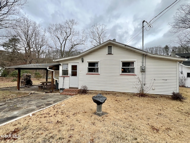 back of property featuring a patio