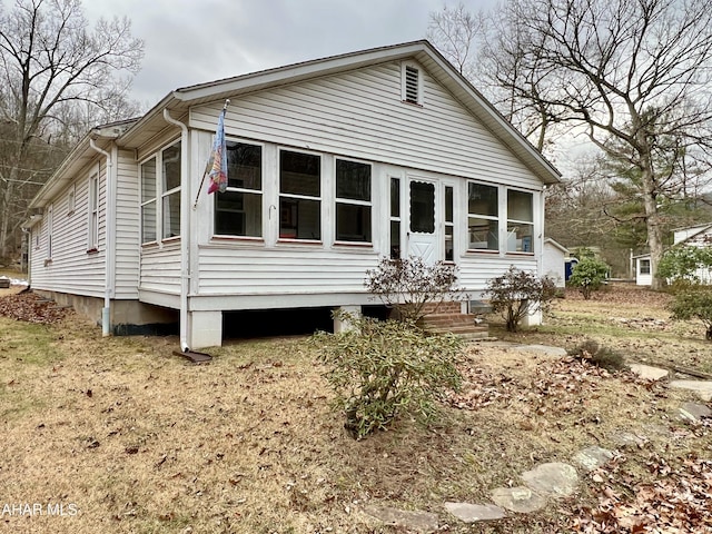 view of front of home with a sunroom