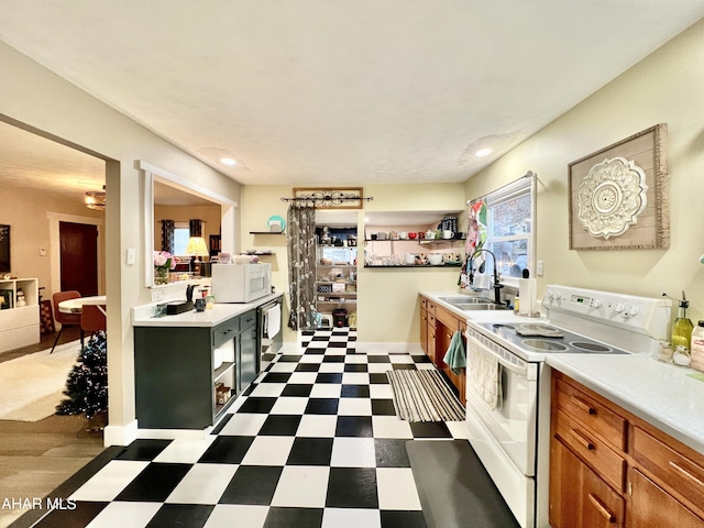 kitchen featuring white appliances and sink