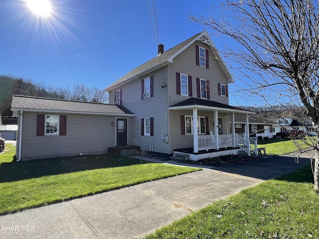 view of front of house with a front lawn and a porch