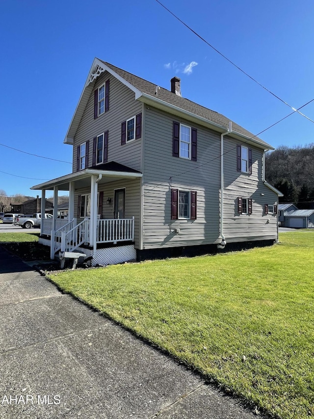 exterior space with a lawn and a porch