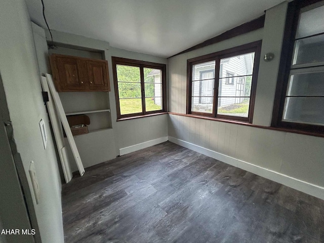 325 Mcfarland Rd, Tyrone, PA 16686 - unfurnished dining area with vaulted ceiling and dark wood-style flooring
