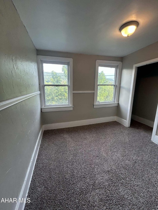 325 Mcfarland Rd, Tyrone, PA 16686 - unfurnished bedroom featuring multiple windows and carpet floors