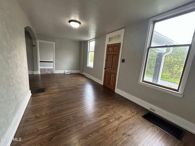 325 Mcfarland Rd, Tyrone, PA 16686 - foyer featuring dark wood-style flooring, a textured wall, and arched walkways