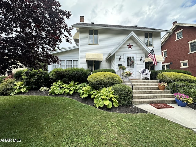 705 Clark St, Hollidaysburg, PA 16648 - traditional-style home featuring a chimney and a front yard