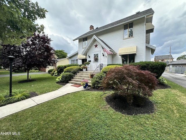 705 Clark St, Hollidaysburg, PA 16648 - view of front of property featuring a chimney and a front yard