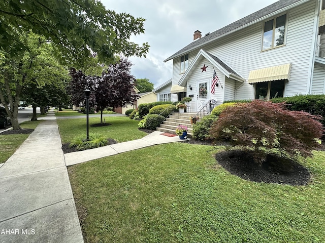 705 Clark St, Hollidaysburg, PA 16648 - view of front of home with a chimney and a front yard
