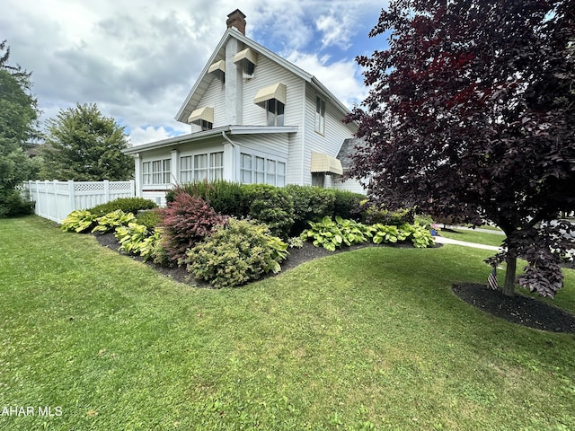 705 Clark St, Hollidaysburg, PA 16648 - view of home's exterior with a chimney