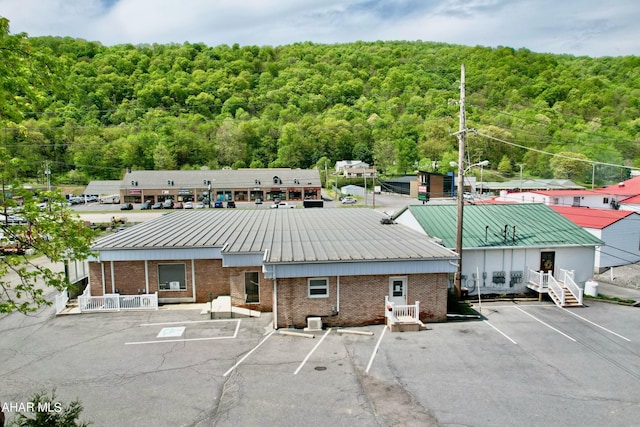 9510 Lincoln Hwy, Bedford, PA 15522 - view of building exterior featuring a forest view and uncovered parking