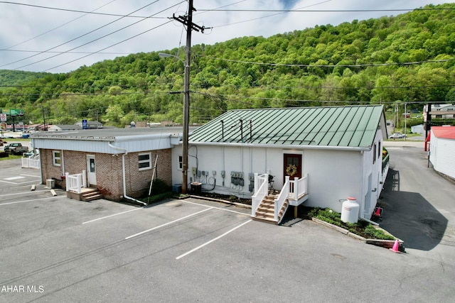 9510 Lincoln Hwy, Bedford, PA 15522 - view of building exterior featuring a view of trees and uncovered parking