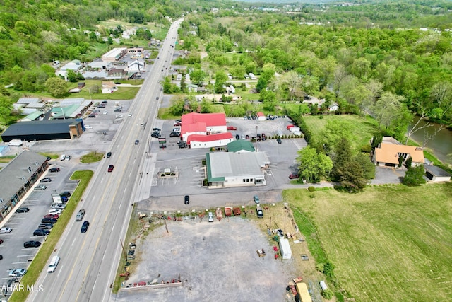 9510 Lincoln Hwy, Bedford, PA 15522 - aerial view of property and surrounding area with a major roadway and a heavily wooded area