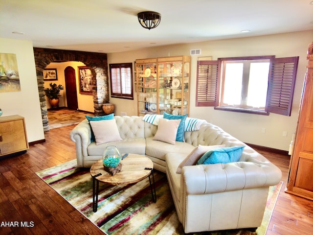 9510 Lincoln Hwy, Bedford, PA 15522 - living room featuring hardwood / wood-style floors and arched walkways