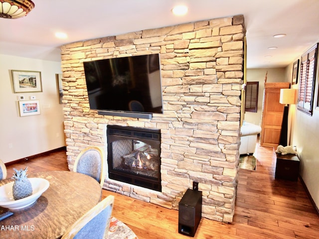 9510 Lincoln Hwy, Bedford, PA 15522 - living room with hardwood / wood-style flooring, a stone fireplace, and recessed lighting