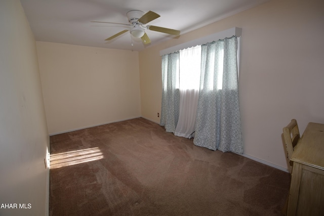 spare room with ceiling fan and carpet floors