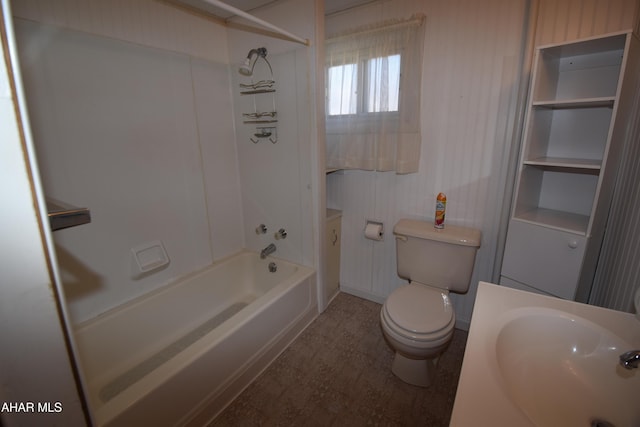 full bathroom featuring toilet, sink, and bathing tub / shower combination