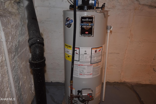 utility room featuring water heater