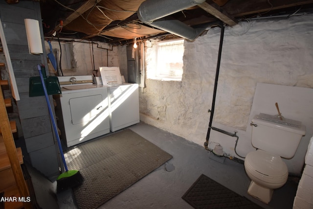 basement with washing machine and dryer and electric panel