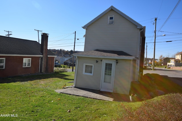 back of house with a yard