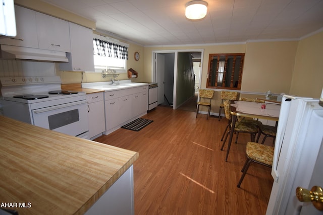 kitchen with white cabinetry, sink, crown molding, white appliances, and light wood-type flooring