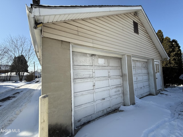 view of snow covered garage