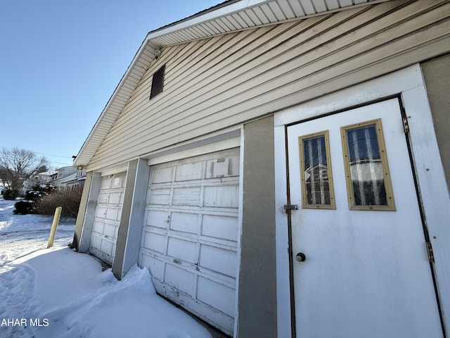 view of snow covered garage