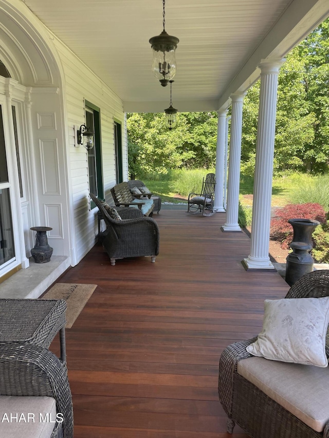 wooden terrace featuring a porch