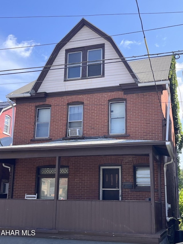 614 S 25th St, Altoona, PA 16602 - view of property exterior featuring brick siding, a gambrel roof, and covered porch