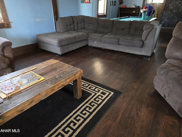 living room with dark hardwood / wood-style flooring