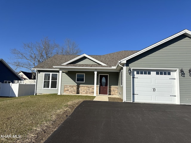 111 Red Tail Cir, Duncansville, PA 16635 - view of front of house with a front lawn, fence, roof with shingles, driveway, and an attached garage