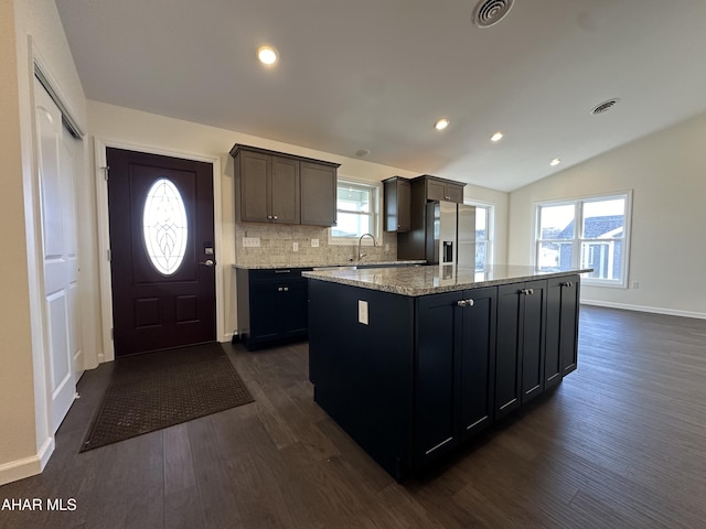 111 Red Tail Cir, Duncansville, PA 16635 - kitchen with dark wood-style floors, visible vents, a kitchen island, stainless steel fridge with ice dispenser, and decorative backsplash