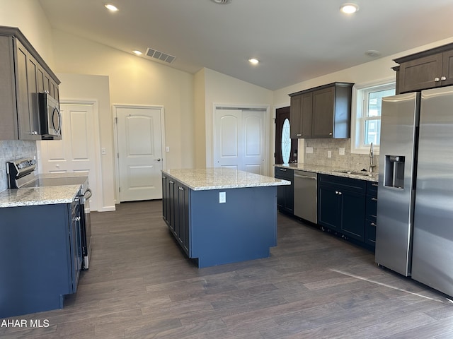 111 Red Tail Cir, Duncansville, PA 16635 - kitchen featuring lofted ceiling, visible vents, appliances with stainless steel finishes, and a center island