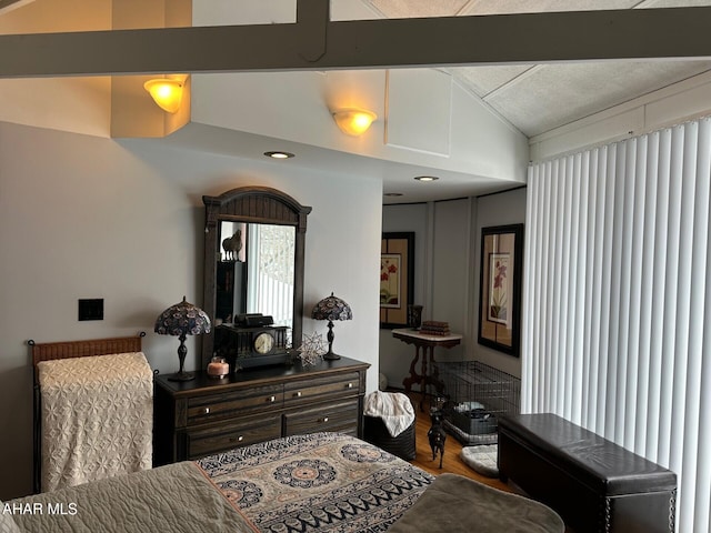 bedroom with lofted ceiling