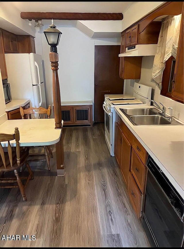 kitchen with sink, black appliances, and dark hardwood / wood-style flooring