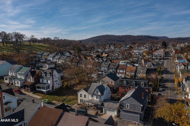 birds eye view of property with a mountain view