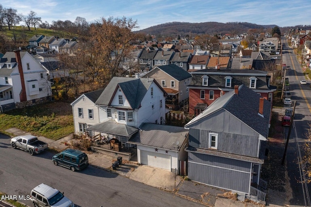 birds eye view of property with a mountain view