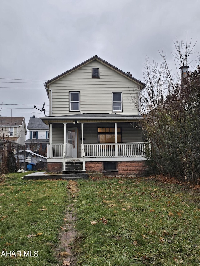 view of front of home featuring a porch and a front lawn