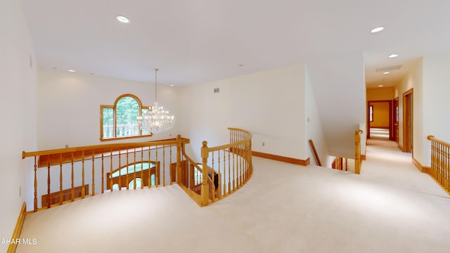 corridor with an upstairs landing, recessed lighting, a chandelier, carpet, and baseboards