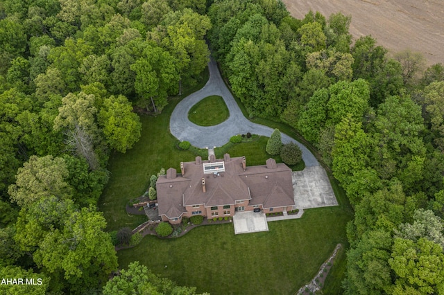 aerial overview of property's location featuring a forest