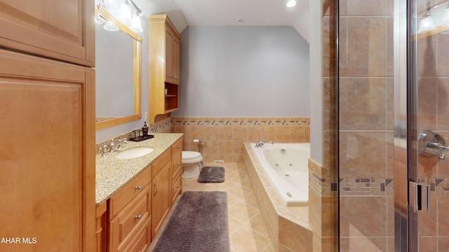 bathroom featuring a shower stall, a jetted tub, tile patterned flooring, vanity, and toilet