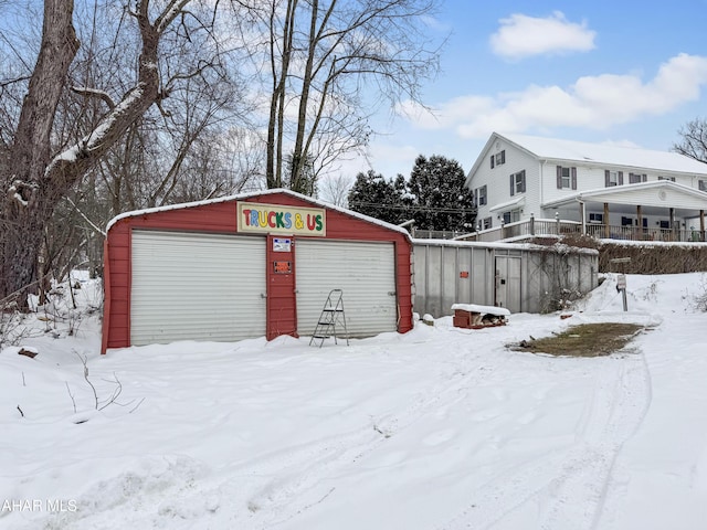 view of snow covered garage