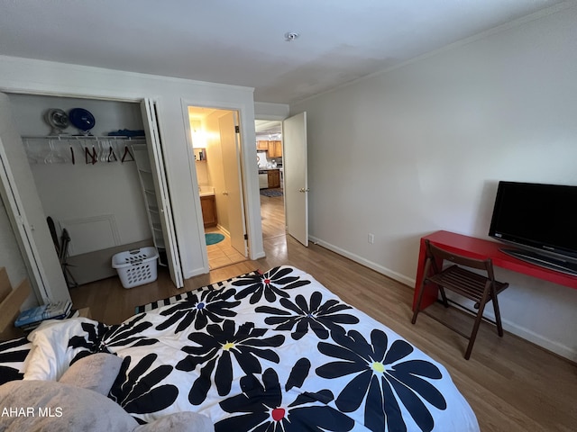 143 E Valley Point Ln, Claysburg, PA 16625 - bedroom with ensuite bathroom, a closet, and wood-type flooring