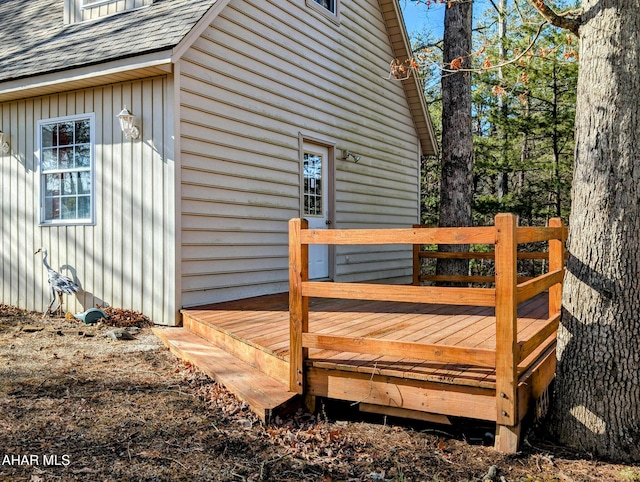 view of property exterior with a deck