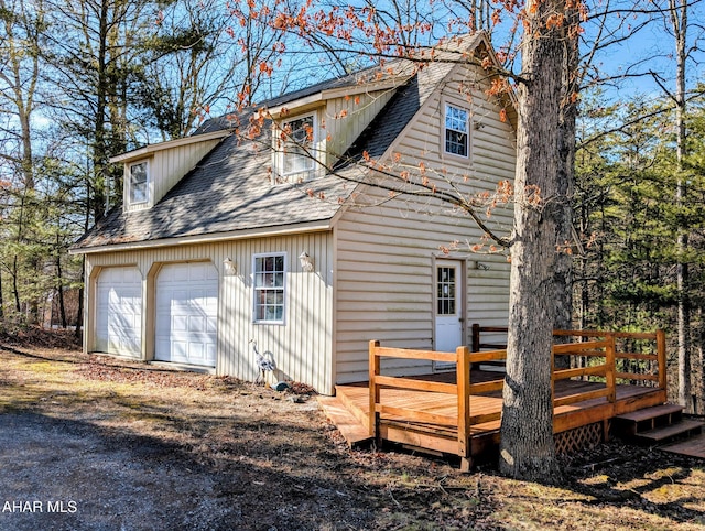 rear view of house featuring a deck